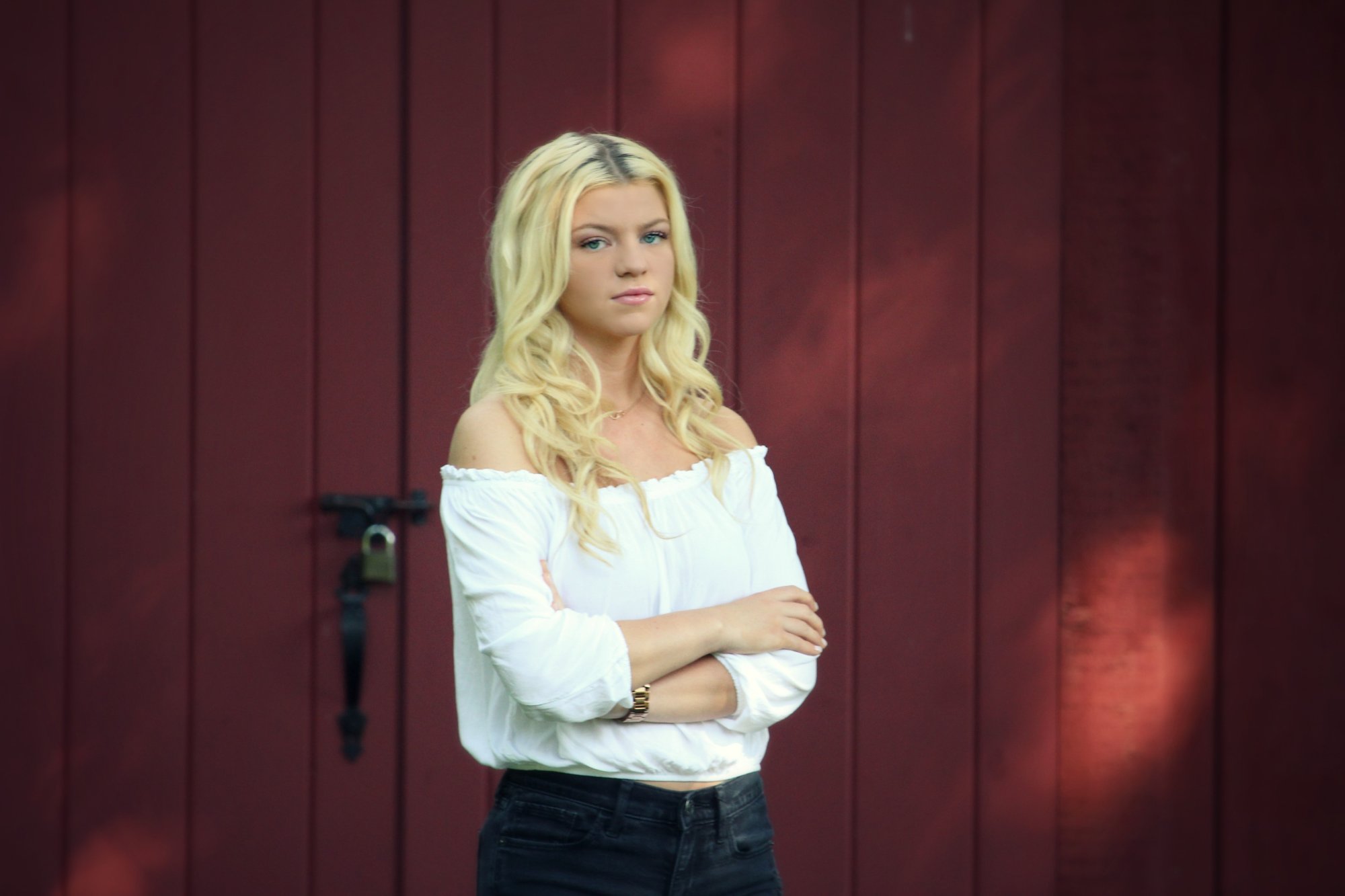 Senior portrait with golden hour light in Livingston County
